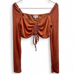 Shimmery rust colored long sleeve crop top